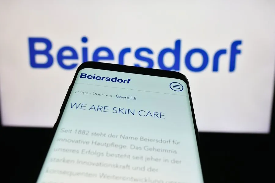 A phone with Beiersdorf We Are Skin Care written on it.